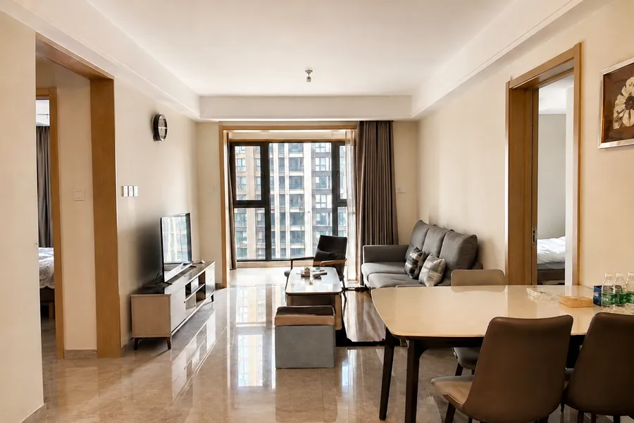 Updated lighting: Real Estate scene before and after: room photo with brighter even listing light